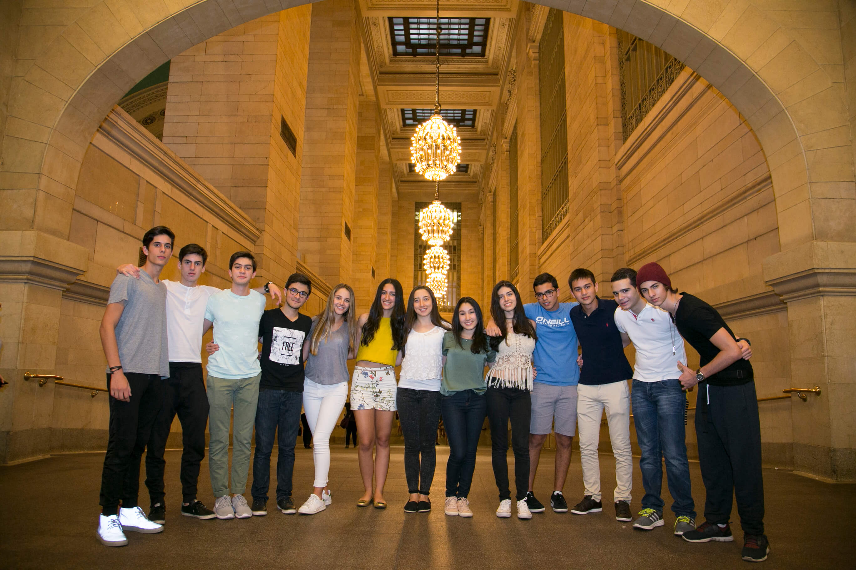 Visionarium students standing together under the arches of Grand Central Terminal.