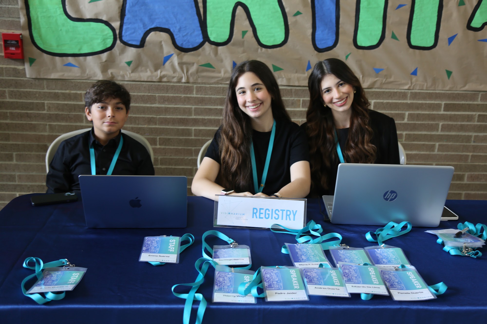 The registry desk team behind their laptops at the start of the day.