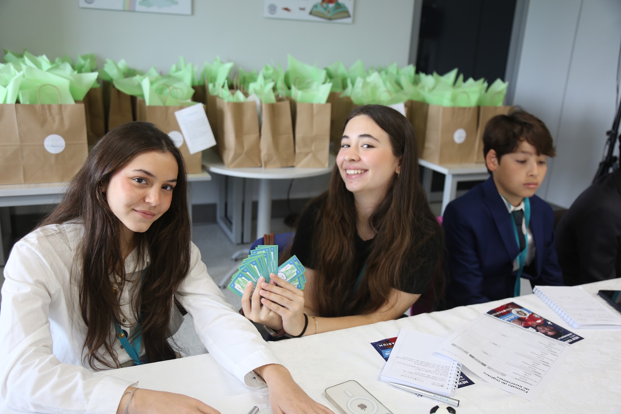 Students laughing together during a table exercise.