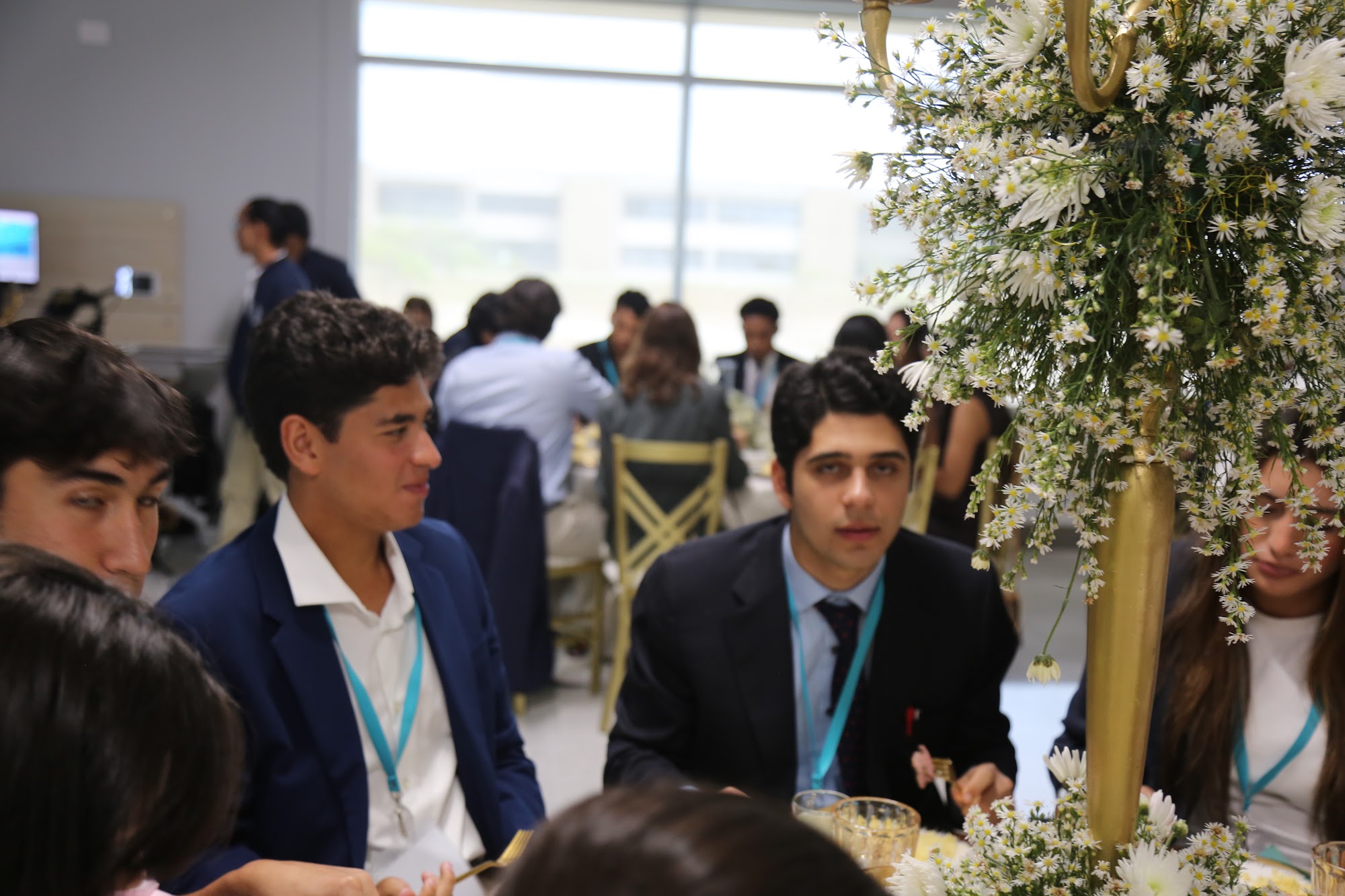 Students in conversation at lunch.