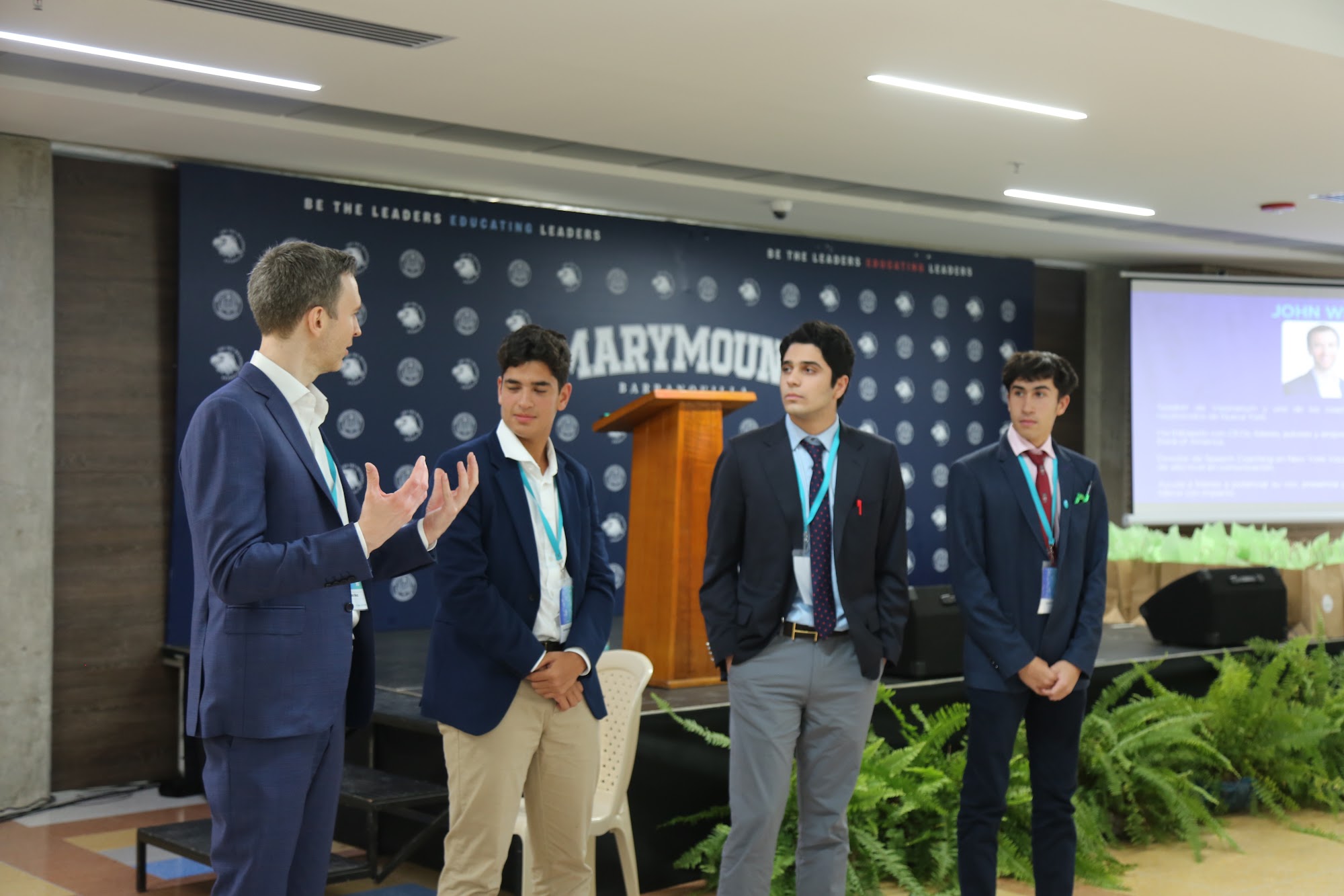 A group of students on stage during the speaking exercise.